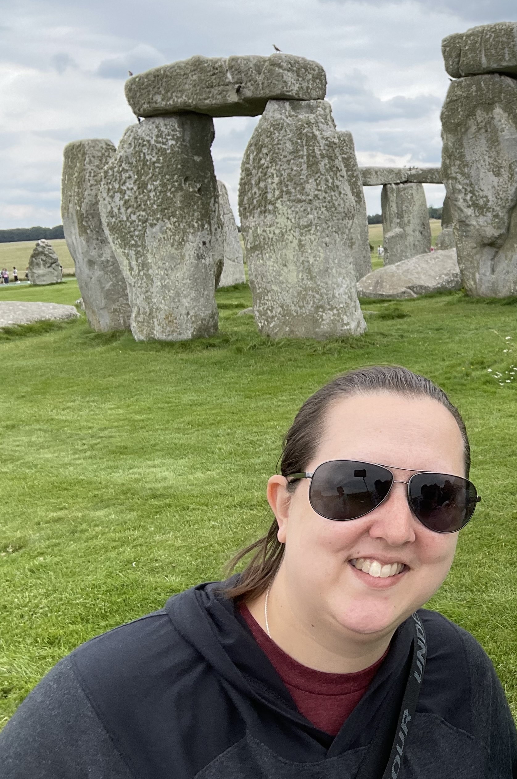 Vicky Berry smiles with Stonehenge in the background in Wiltshire, England