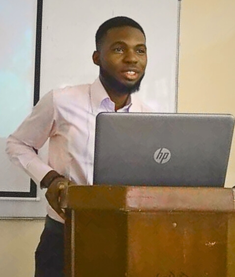 Victor Irekponor gives a presentation as a bachelor's student in Lagos, Nigeria