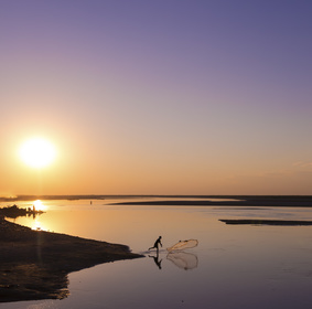fisherman casts net