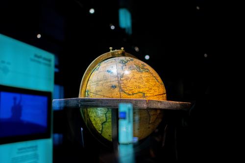 Yellow globe in front of a dark background