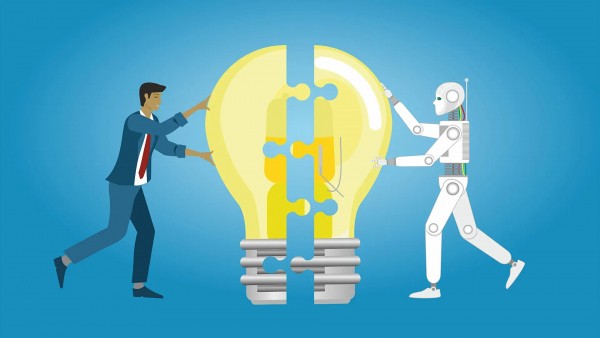 A man wearing a suit and a robot hold a light bulb together, symbolizing collaboration and innovation.