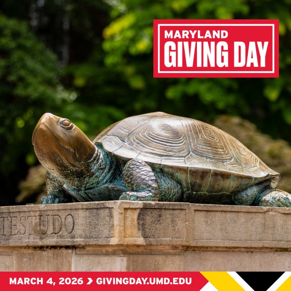A bronze statue of Testudo, the University of Maryland’s diamondback terrapin mascot, sitting on a stone pedestal. The top right features a red box with the white text "MARYLAND GIVING DAY." A red banner at the bottom displays the date "MARCH 4, 2026" followed by the website "GIVINGDAY.UMD.EDU," accented by the gold, black, and white patterns of the Maryland state flag.