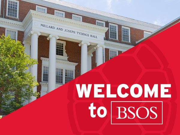 Exterior view of Millard and Joseph Tydings Hall, a brick campus building featuring white pillars, overlaid with a red graphic reading "WELCOME to BSOS".