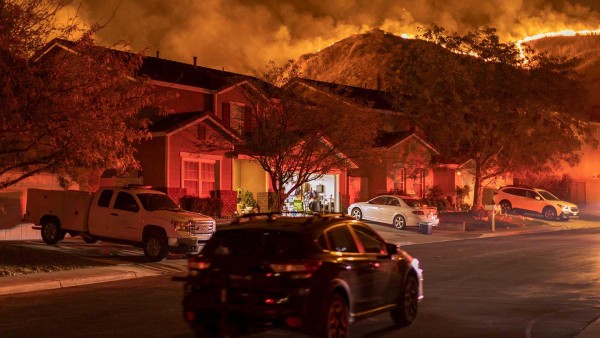 Flames menace a Chino, Calif., neighborhood during the Blue Ridge Fire in October 2020.