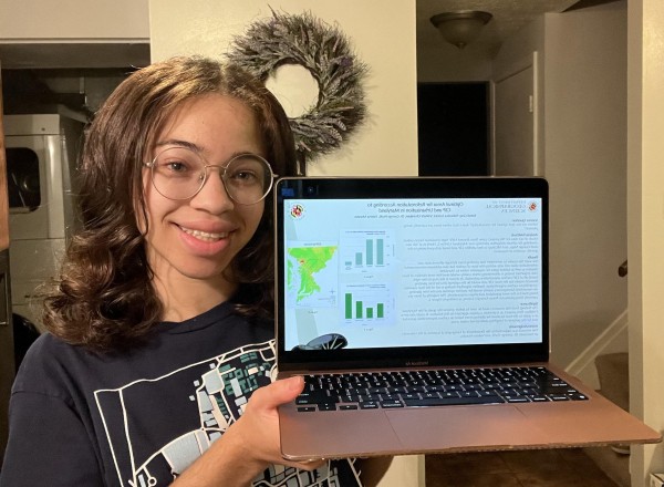 High school student Kendi Gray shows her computer displaying her poster.