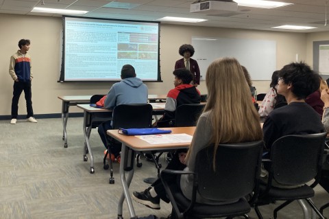 High school students Urkit and Alejandro present their internship research, as part of GEOG's Outreach.