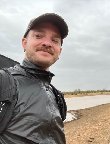 Chriistian Fohringer next to a river. He is blond and has facial hair