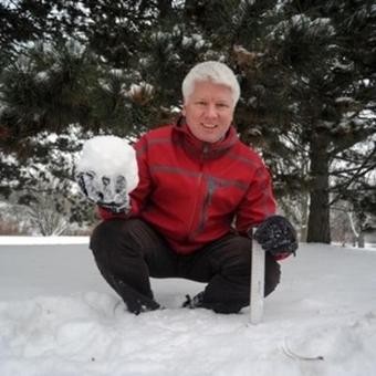 Richard Kelly holding a large snowball