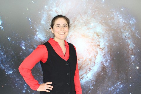 Abigail Barenblitt in front of galaxy backdrop