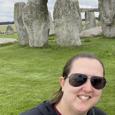 Vicky Berry smiles with Stonehenge in the background in Wiltshire, England